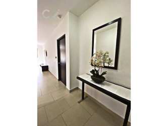 Bright bedroom featuring large windows, fan, wood floors in PH Soleo Panama Pacifico