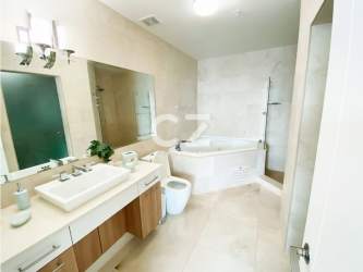 Living dining area with bright natural light and balcony access in beachfront PH Casa Bonita Panama