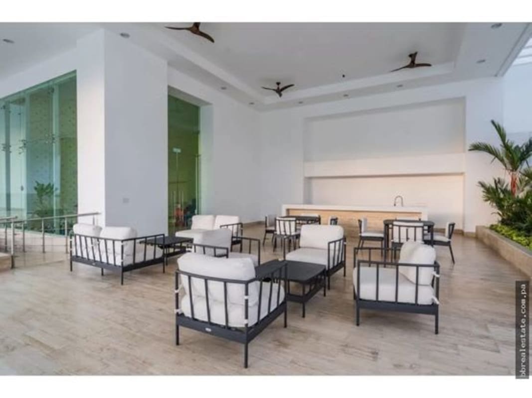 Contemporary bathroom with glass shower marble tile and modern fixtures PH Aria Panama