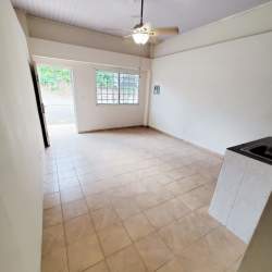 Minimalist kitchen with cabinets, sink and tile backsplash in apartment for rent in Arraiján Panama