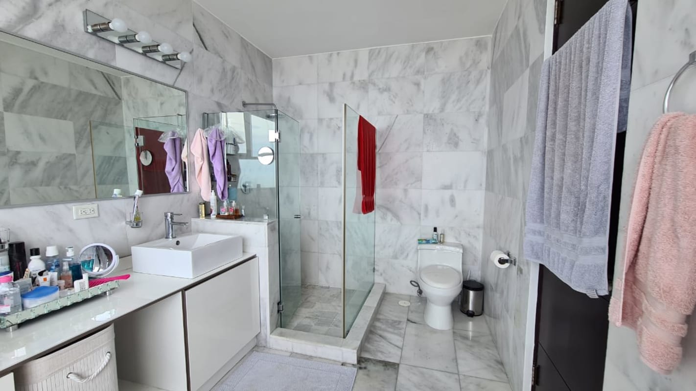 Study room with bookshelves AC red sofa wooden floor PH Pearl on the Sea Panama