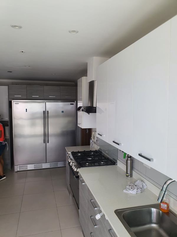 Living room with large window and city view PH Park Lane Costa del Este Panama