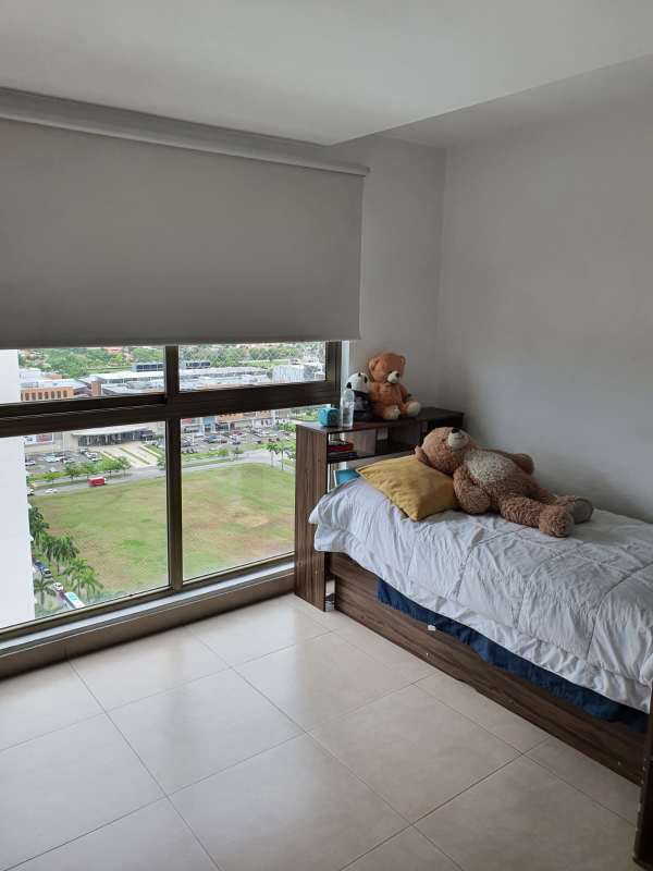 Bright bedroom with panoramic window and ocean city skyline PH Park Lane Costa del Este Panama