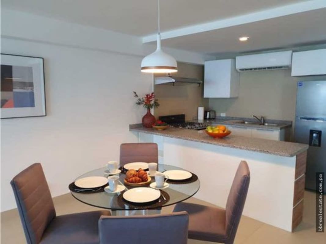 Master bedroom with large windows and direct ocean view PH Isla Naos Causeway Panama City