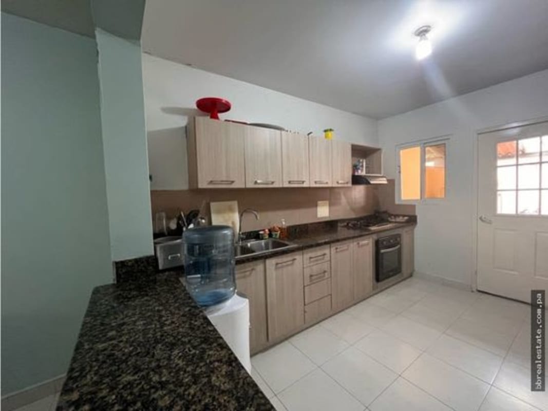 Front yard with palm trees and decorative plants in gated community Panama City