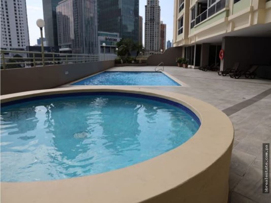 Spacious bedroom featuring built-in closet and large windows with cityscape views Punta Pacifica