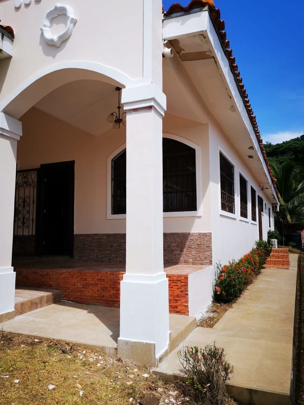 Spacious kitchen with wood cabinetry granite countertops and ceramic tile Las Cumbres Panama Home