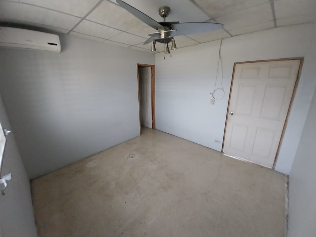 Minimalist bedroom with ceiling fan and AC in investment rental property San Antonio