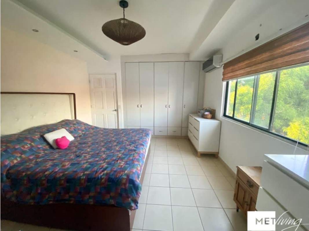 Master bedroom with AC, white wardrobe, window in Parque Lefevre apartment Panama City
