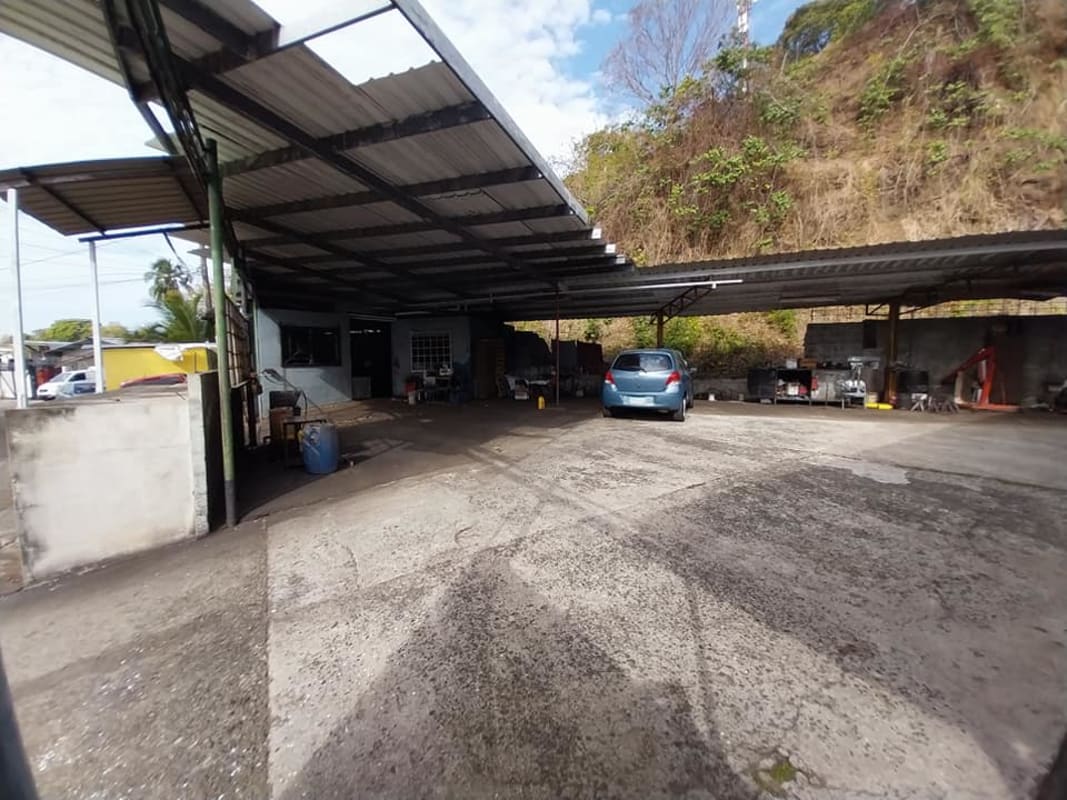 Metal roof covered shelters on paved industrial lot with gate for sale Pueblo Nuevo Panama City
