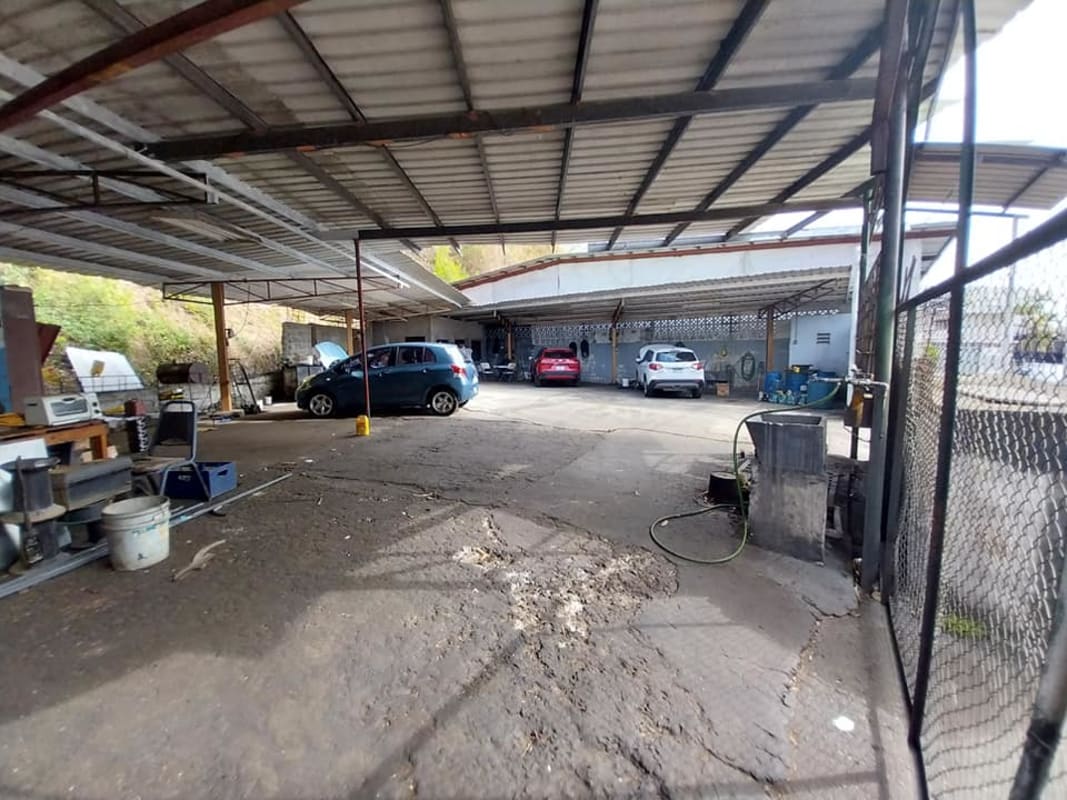 Parking area with multiple covered metal shelters, commercial property available Pueblo Nuevo Panama