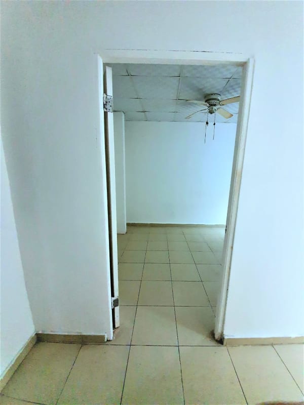 Interior corridor view security doors tiled floor rental apartments Betania Panama City