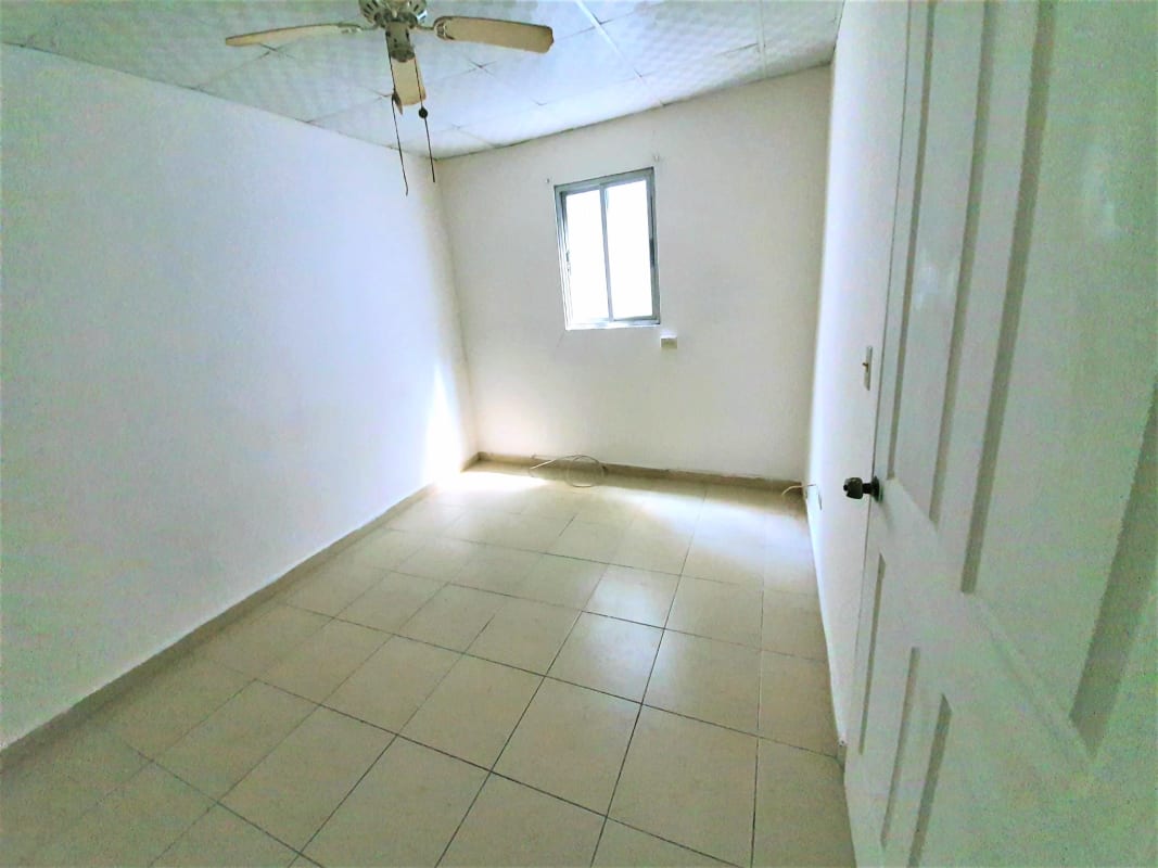 Empty bright bedroom space tile floor ceiling fan secure affordable studio Panama City