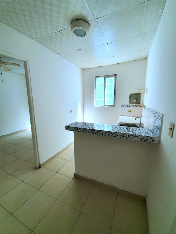 Small kitchen with patterned tile border open shelving rental studio Betania Panama City