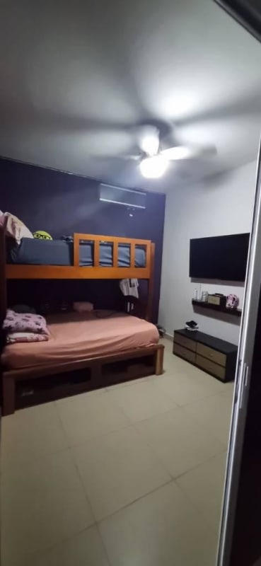 Guest bedroom overlooking Panama City skyline in luxury apartment PH Rivage Tower