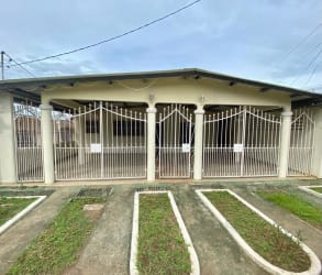 Gated front entrance and parking area at house in Fuente del Chase La Chorrera Panama