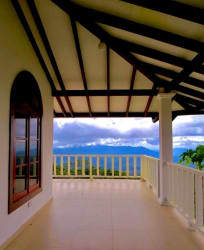 Colonial facade with columns, staircase, gardens and veranda at Altos del María estate