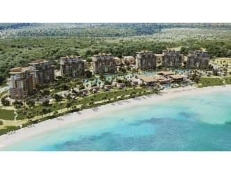 Multi-story beachfront condos with balconies facing ocean at Playa Escondida Resort Panama