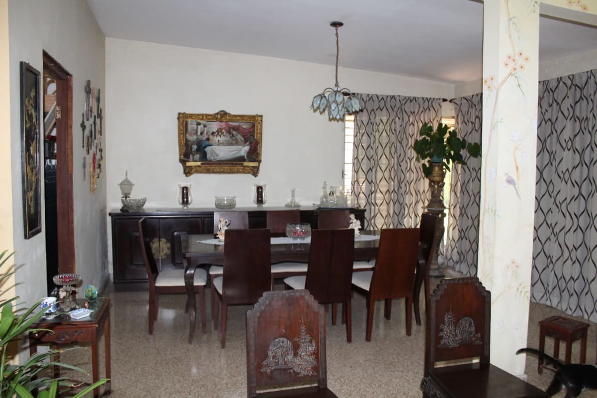 Traditional dining area with wooden furniture and chandelier Las Cumbres Panama