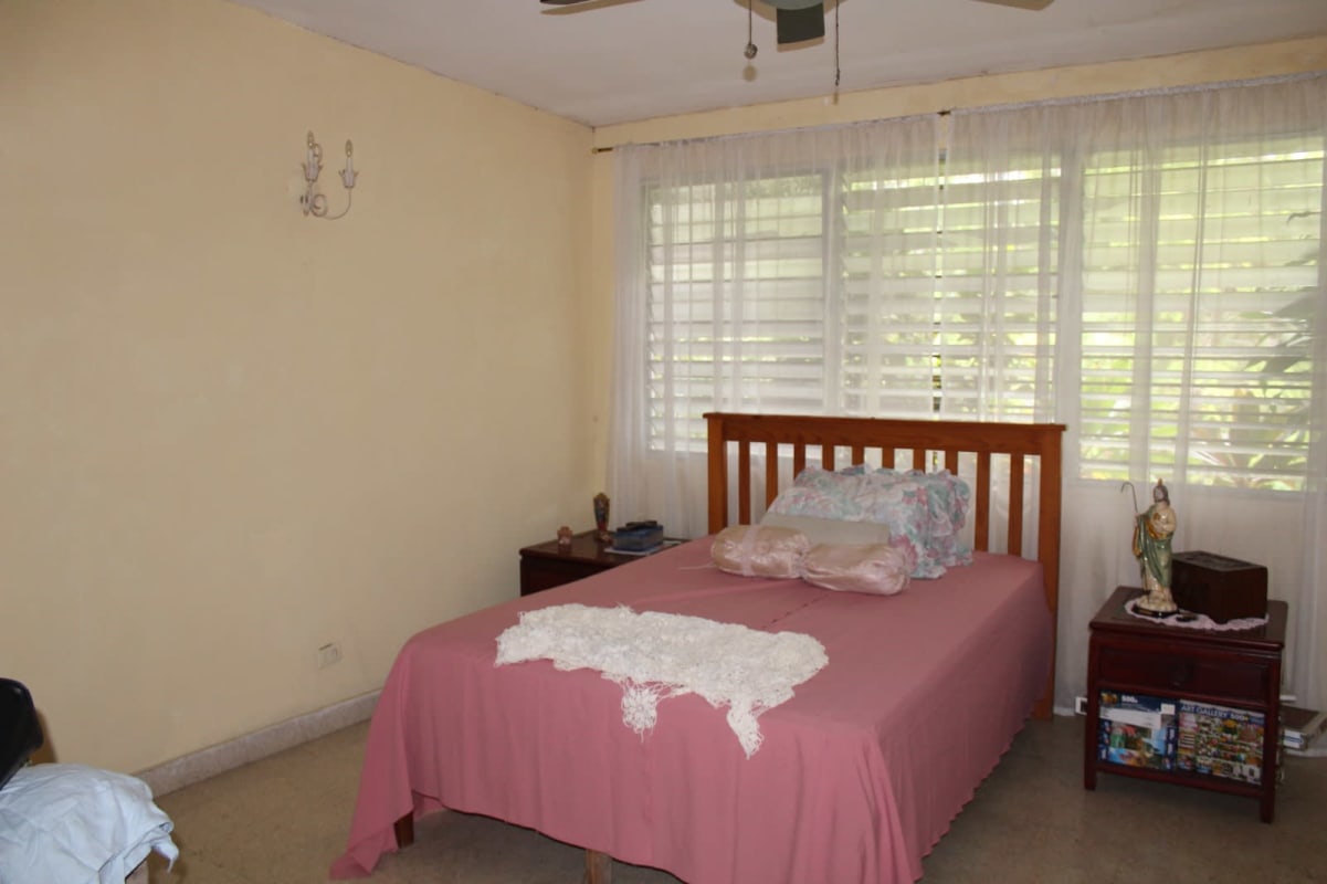 Vintage kitchen with checkered curtains and classic appliances Las Cumbres Panama
