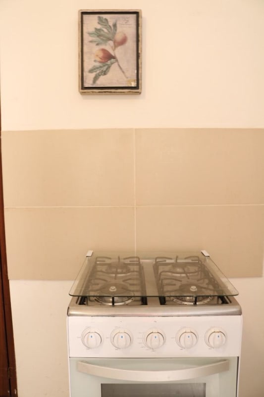 Compact minimalist kitchen with stove, fridge, microwave PH 12 de Octubre Panama