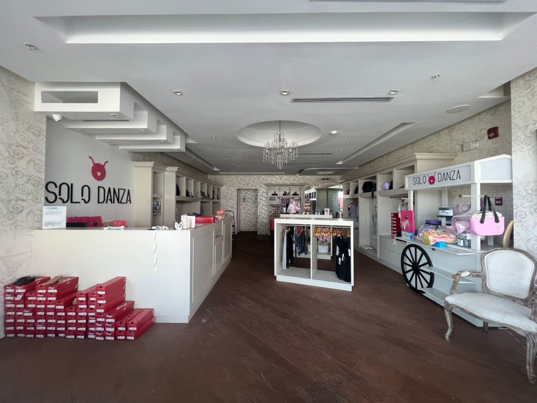 Retail boutique interior with chandelier, counters, display racks inside PH Centennial Center Panama City