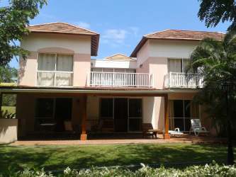 Two-story Mediterranean house with balconies and lush garden in Playa Blanca Panama
