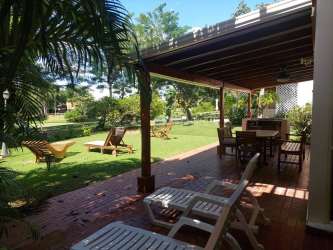 Covered terrace patio with garden view in Playa Blanca beach house for sale