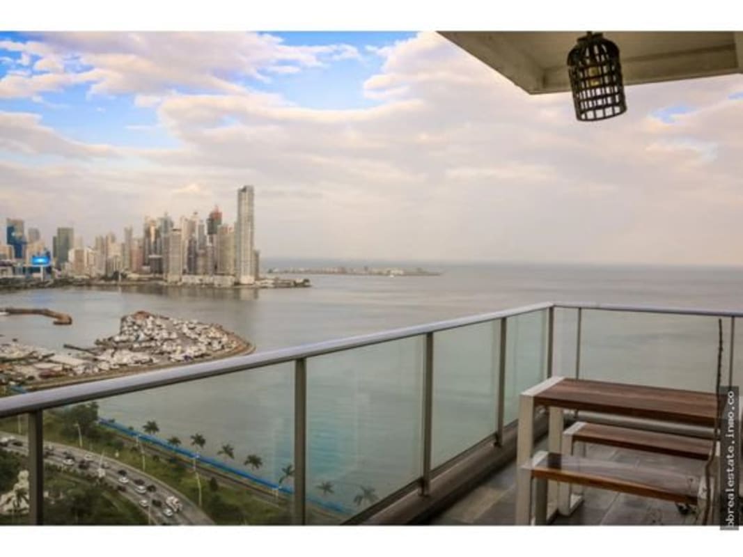 Balcony seating with skyline and Pacific Ocean view in PH Destiny tower.