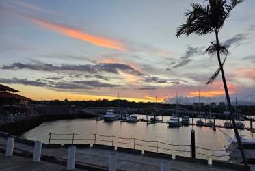 Marina with boats under sunset sky at PH Marina Golf inside Vista Mar Resort Panama