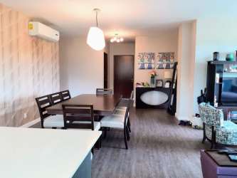 Bedroom with sliding glass doors to terrace and natural light in Panama Pacifico