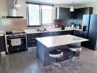 Master suite with wood floors, private bath, and closet in River Valley Panama Pacifico