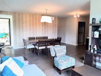 Spacious terrace balcony overlooking mountains and gardens at River Valley Panama Pacifico