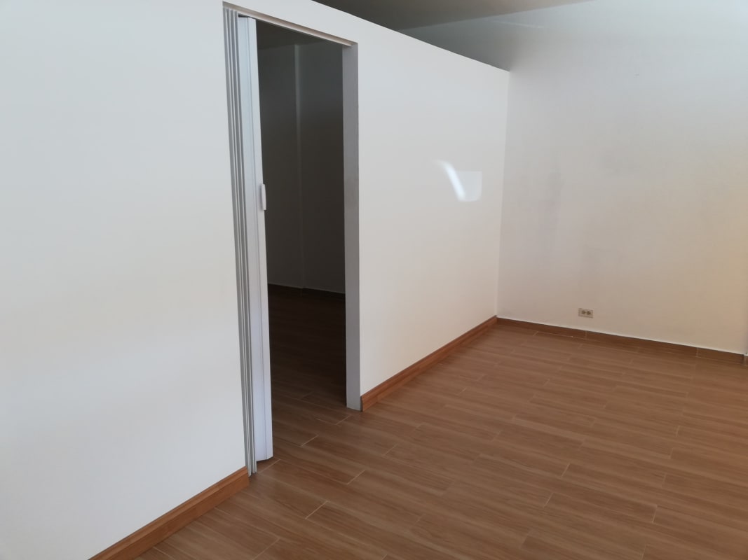Room with sliding door and wood tile flooring in commercial unit Albrook Panama
