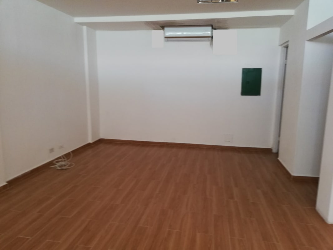 Spacious commercial interior with wood tile flooring in Albrook Plaza Panama