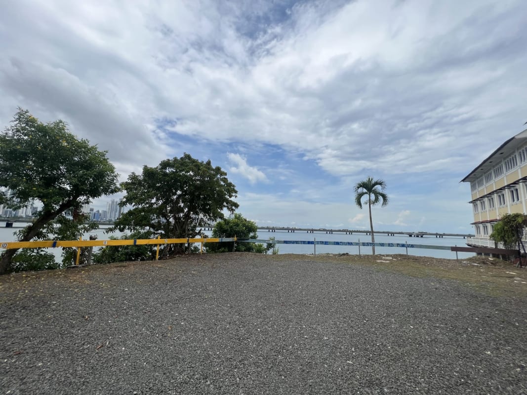 Casco Viejo waterfront lot with historic building, palm, ocean and skyline Panama