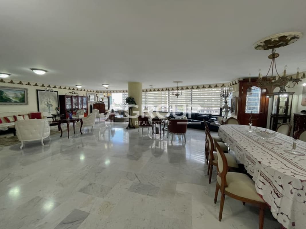 Classically decorated living room with marble flooring, crown molding, at PH Bayshore Punta Paitilla Panama