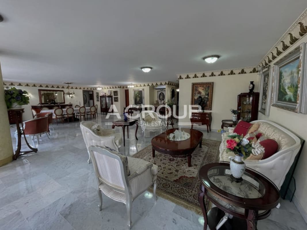 Classic furnished living room with marble floor, panoramic city views, at PH Bayshore Punta Paitilla Panama