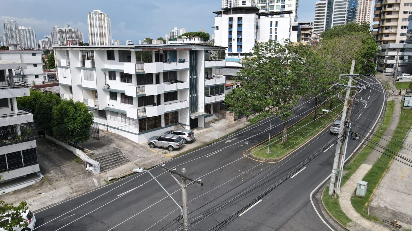 Concrete 5-story property with commercial base and residential units balconies Obarrio Panama City