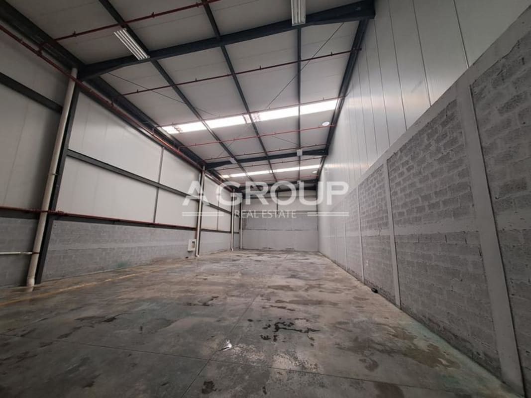 Spacious empty industrial warehouse interior with concrete floors high ceilings in Centro Logistico Dos Caminos Panama