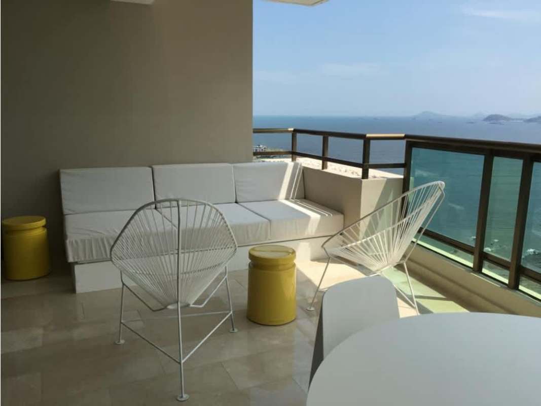 Balcony lounge with cushioned built-in bench, ocean views at PH Ocean Park Panama City Condo