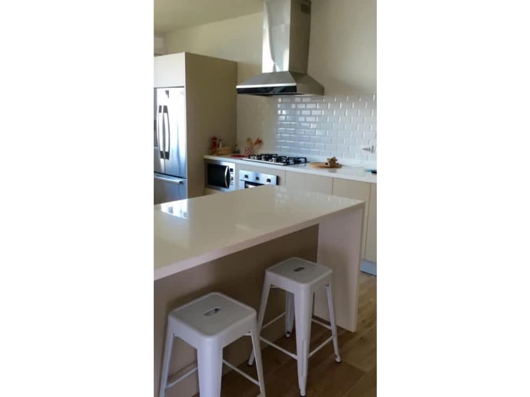 Modern kitchen with island, stainless steel appliances PH Ocean Park Punta Pacifica Panama