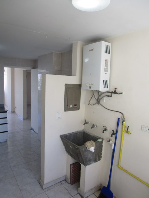 Laundry area with utility sink in apartment PH El Carmen Panama City