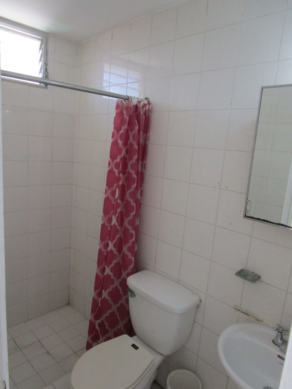 Simple tiled bathroom with walk-in shower PH El Carmen Panama Apartment