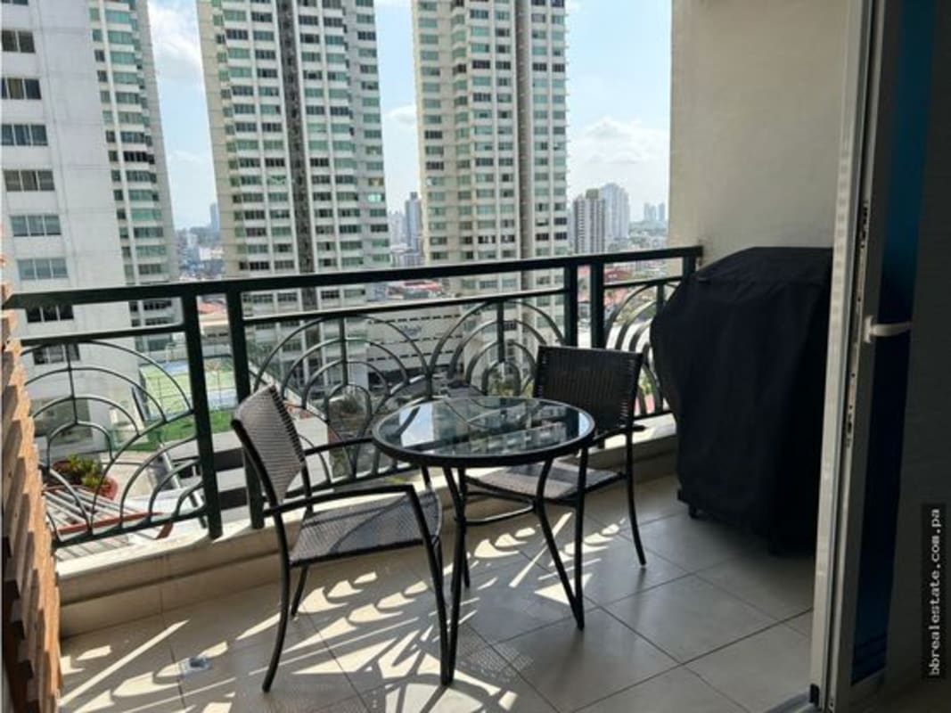 Private balcony with grill and table city skyline PH Belview Towers