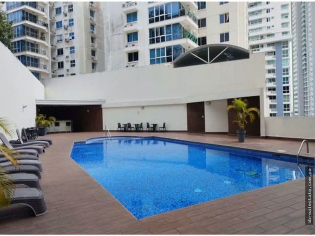 Outdoor swimming pool with lounge chairs PH Belview Towers Edison Park