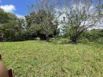 Spacious fenced land parcel with trees green grass El Valle Antón Panama for sale