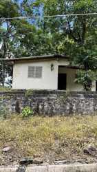 Small single-story house on country lot with mature trees in Sorá Panama