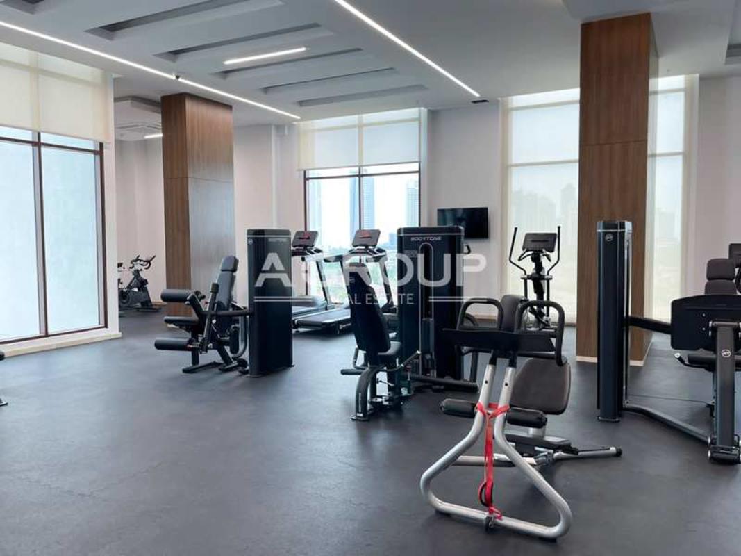 Luxury fitness center with equipment, large windows with city view at The Colonial Santa Maria Panama