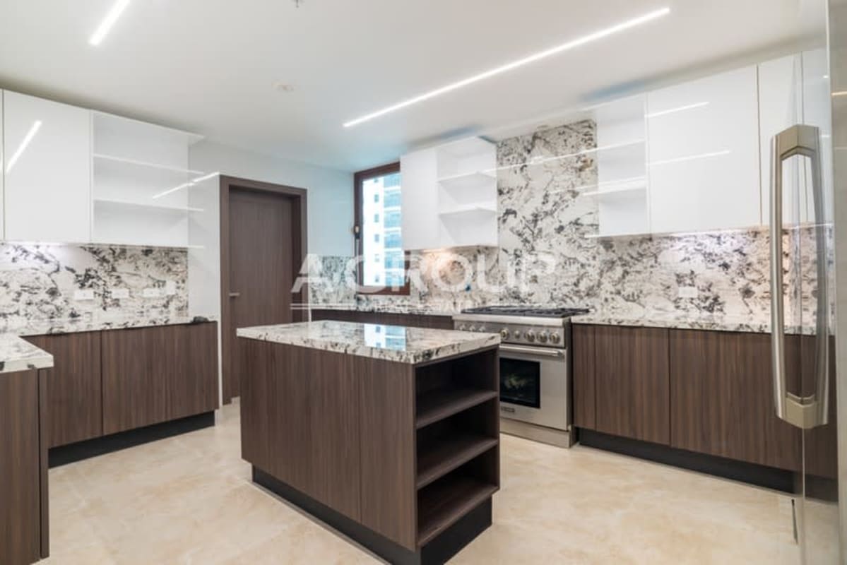 Luxury modern kitchen with marble island, stainless steel appliances, spacious cabinetry in The Colonial, Santa Maria Panama